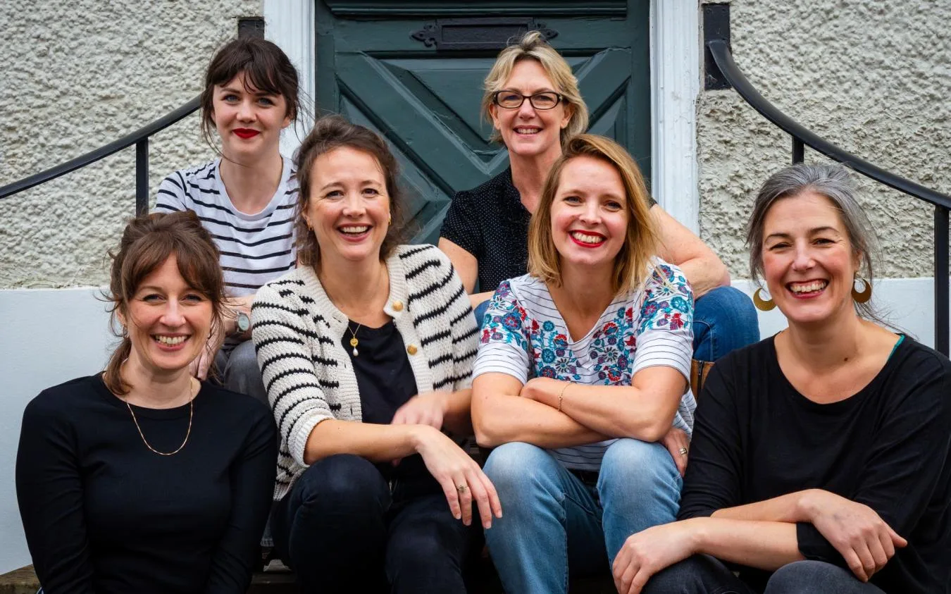 Group of smiling women outdoors